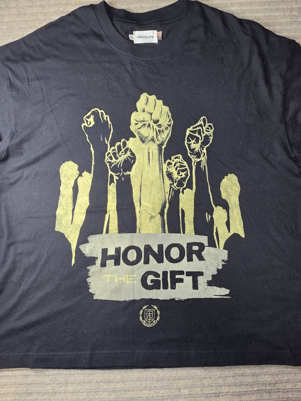 HONOR THE GIFT Black Dignity Graphic Tee with Yellow-Gold Fist Design